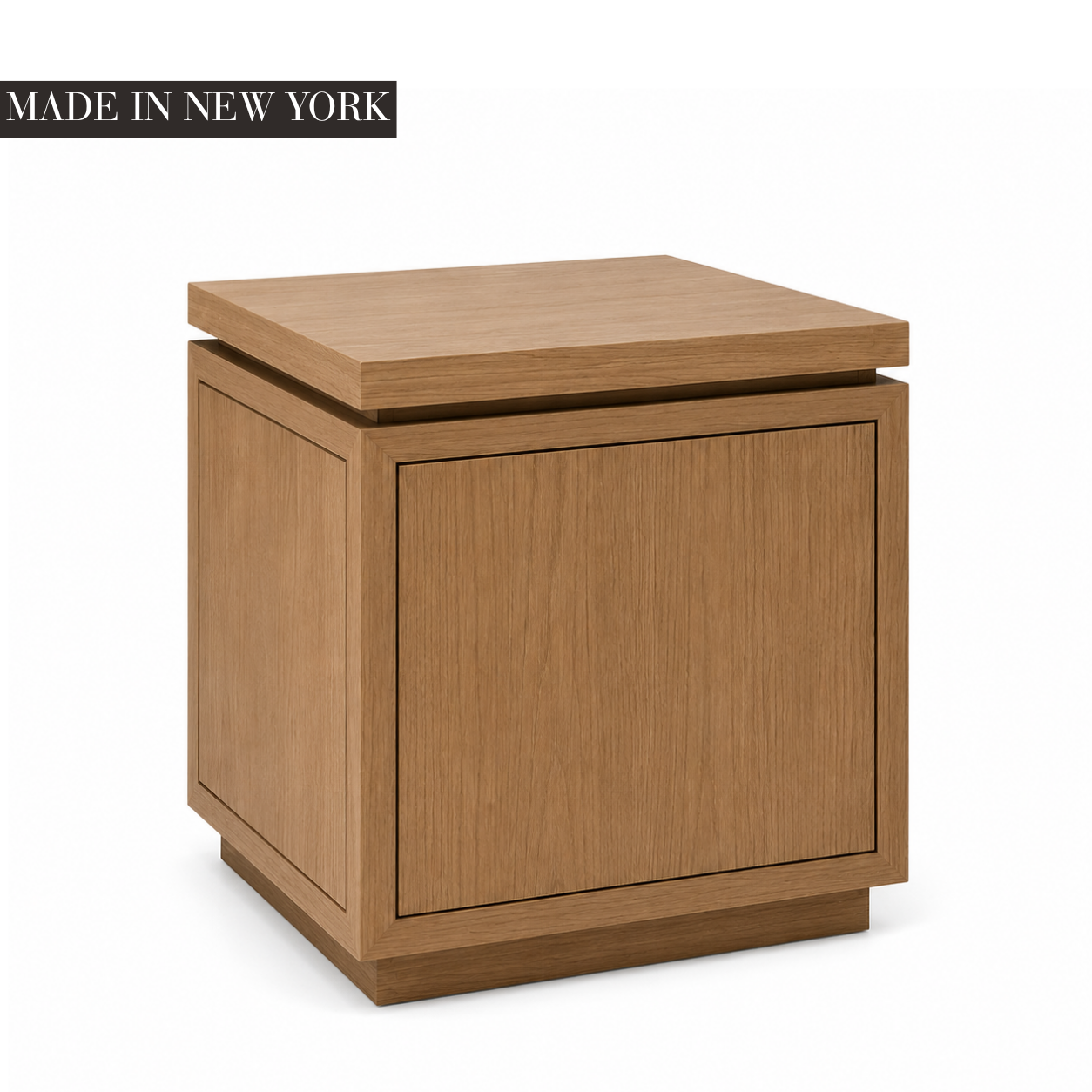 Architectural oak side table with framed panel detailing, floating top and recessed plinth base, handcrafted in New York by Cambridge Kitchens.