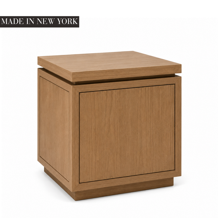 Architectural oak side table with framed panel detailing, floating top and recessed plinth base, handcrafted in New York by Cambridge Kitchens.