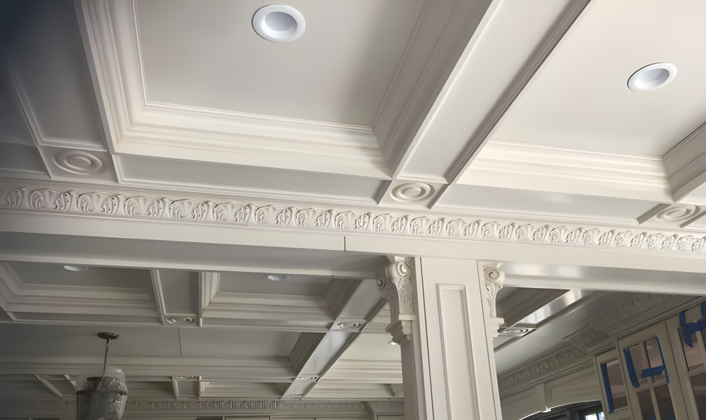 Custom coffered ceiling with detailed crown molding, carved architectural millwork and integrated lighting by Cambridge Kitchens on Long Island.