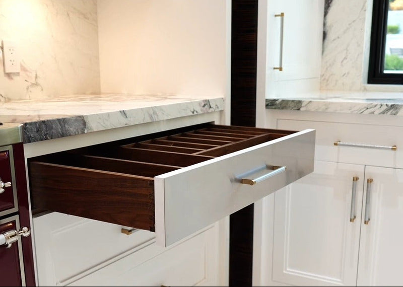 Custom walnut drawer organization designed for a luxury Cambridge Kitchens kitchen.