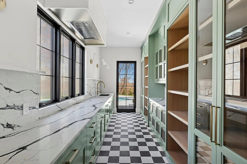 Custom secondary kitchen and scullery with green cabinetry by Cambridge Kitchens.