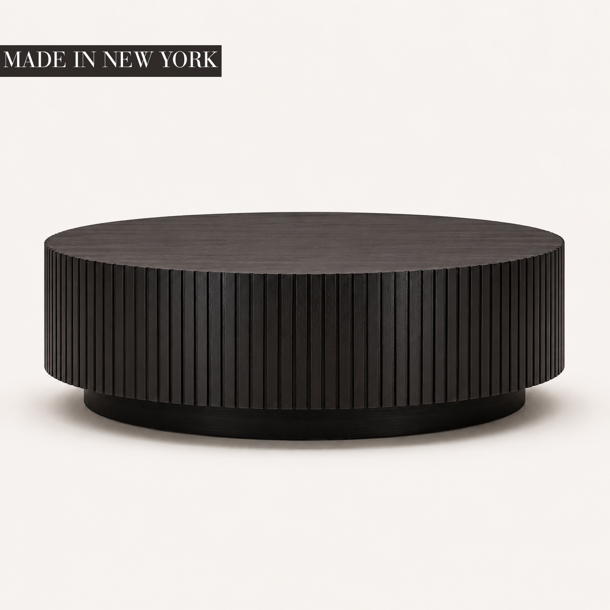 Dark walnut Fluted Round Coffee Table with precision vertical fluting and recessed plinth base, handcrafted in New York by Cambridge Kitchens.