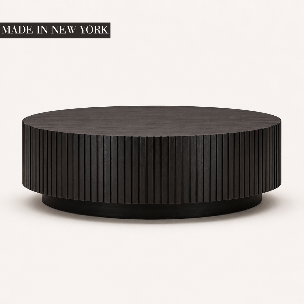 Dark walnut Fluted Round Coffee Table with precision vertical fluting and recessed plinth base, handcrafted in New York by Cambridge Kitchens.
