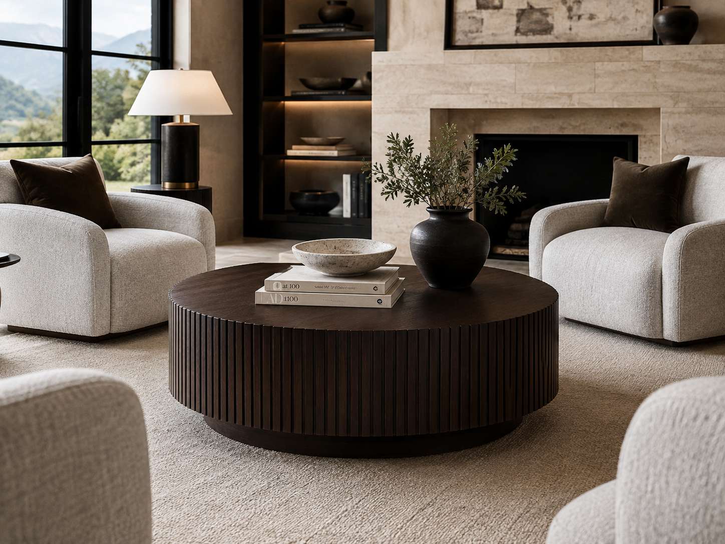 Front view of a handcrafted fluted round walnut coffee table with a recessed plinth base by Cambridge Kitchens Mfg., designed for luxury living spaces.