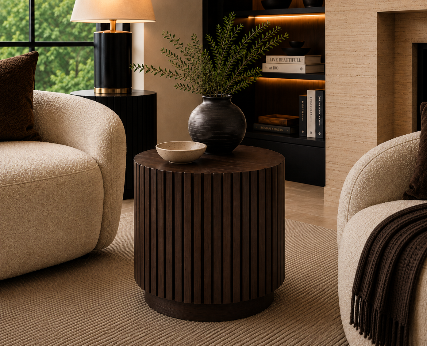 Dark walnut Fluted Round Side Table with vertical fluting and recessed plinth base, staged in a luxury living room by Cambridge Kitchens.
