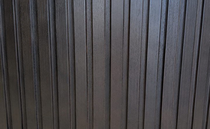 Close-up of the precision-machined 1/2-inch walnut fluting on the Cambridge Kitchens Fluted Round Coffee Table.