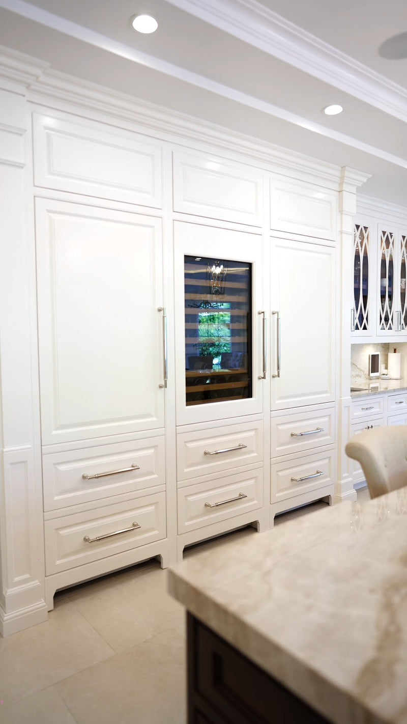 Integrated refrigeration concealed within custom kitchen cabinetry by Cambridge Kitchens.