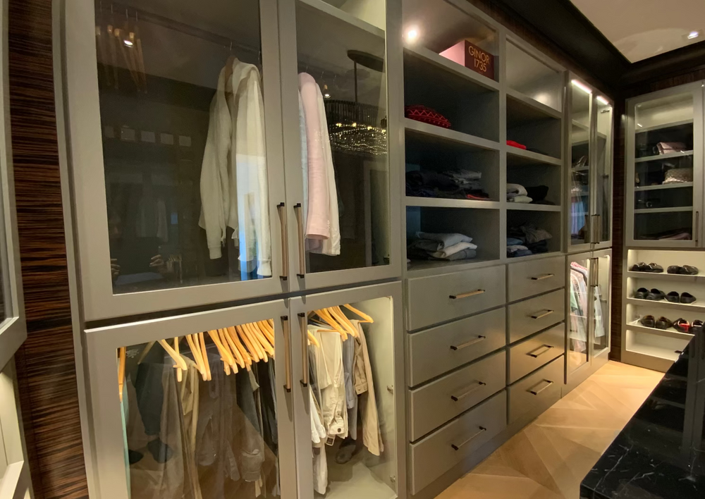 Luxury custom closet with bespoke cabinetry by Cambridge Kitchens.