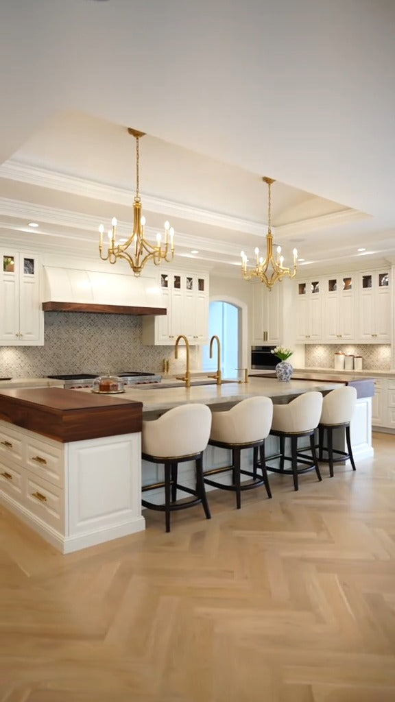 Oversized custom kitchen island with integrated seating by Cambridge Kitchens.