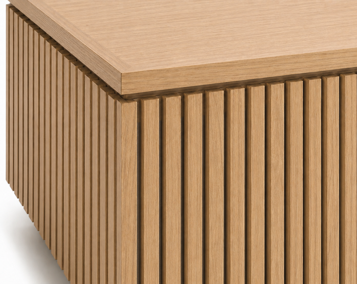 Close-up of The Ribbed Coffee Table showcasing precision-machined 3/4-inch solid rift white oak ribs, 1/2-inch open reveals, and the architectural shadow reveal beneath the 1.25-inch thick tabletop.