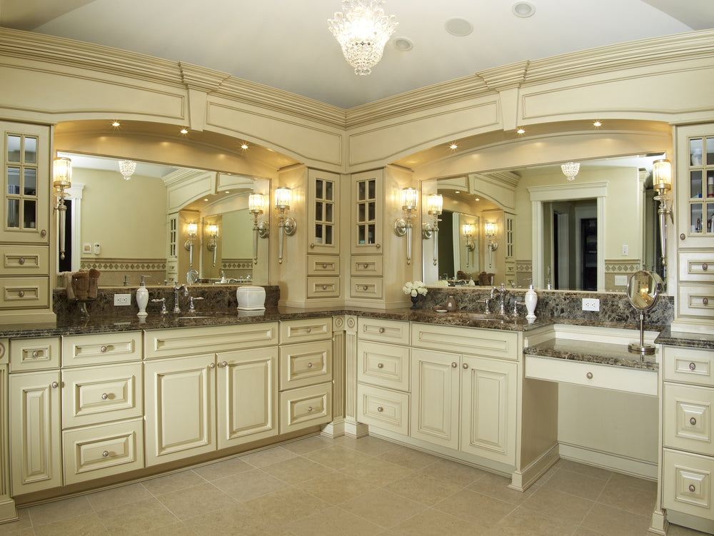 Traditional luxury custom bathroom vanity with detailed cabinetry, built-in storage, makeup station and architectural millwork by Cambridge Kitchens on Long Island.